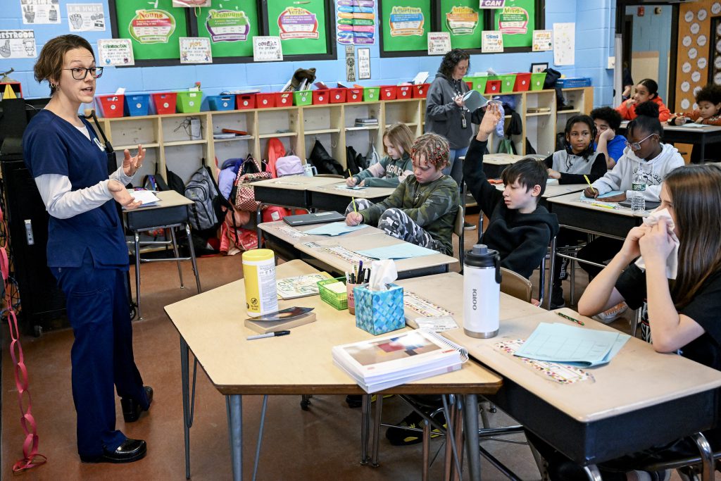 RN/Nurse Instructor Pamela Hunt speaks to grade 5 students in Mrs. Pollock-Sawyer’s class during annual Pinewood Elementary Career Day